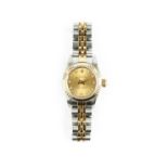 A lady's stainless steel, yellow gold and diamond set automatic 'Oyster Perpetual' bracelet watch by
