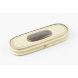 A Georgian ivory patch box, of elongated oval form, with oval hairwork panel to the cover, and