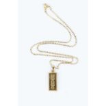 A 9ct gold ingot pendant, suspended from a 9ct gold curb-link chain, pendant length 3.35cm, chain