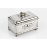 A 19th century Polish silver rectangular casket, with recumbent lion finial, foliate embossed
