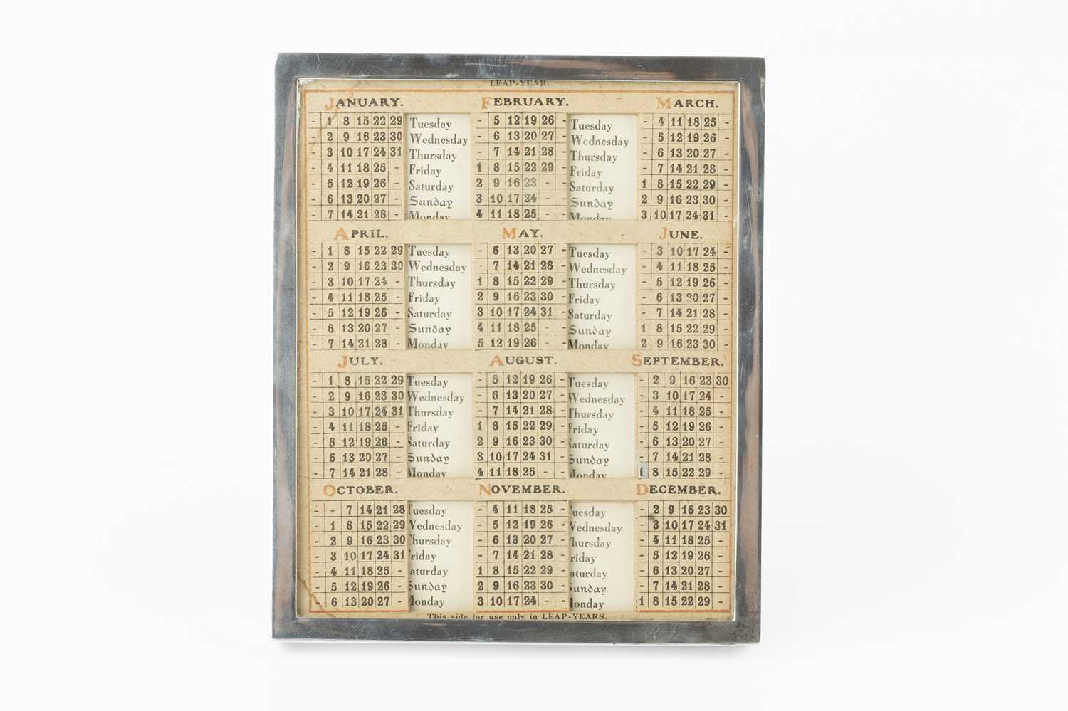 A silver rectangular easel back perpetual calendar, by John Collard Vickery, London 1928, containing