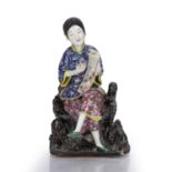 Portrait figure of an artist Chinese, late 19th Century the seated figure holding a brush in one