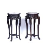 Pair of marble-topped tables Chinese, late 19th Century top inset with a mottled marble panel
