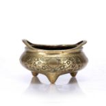 Bronze tripod censer/ding Chinese, 18th/19th Century with raised loop handles, the side incised with