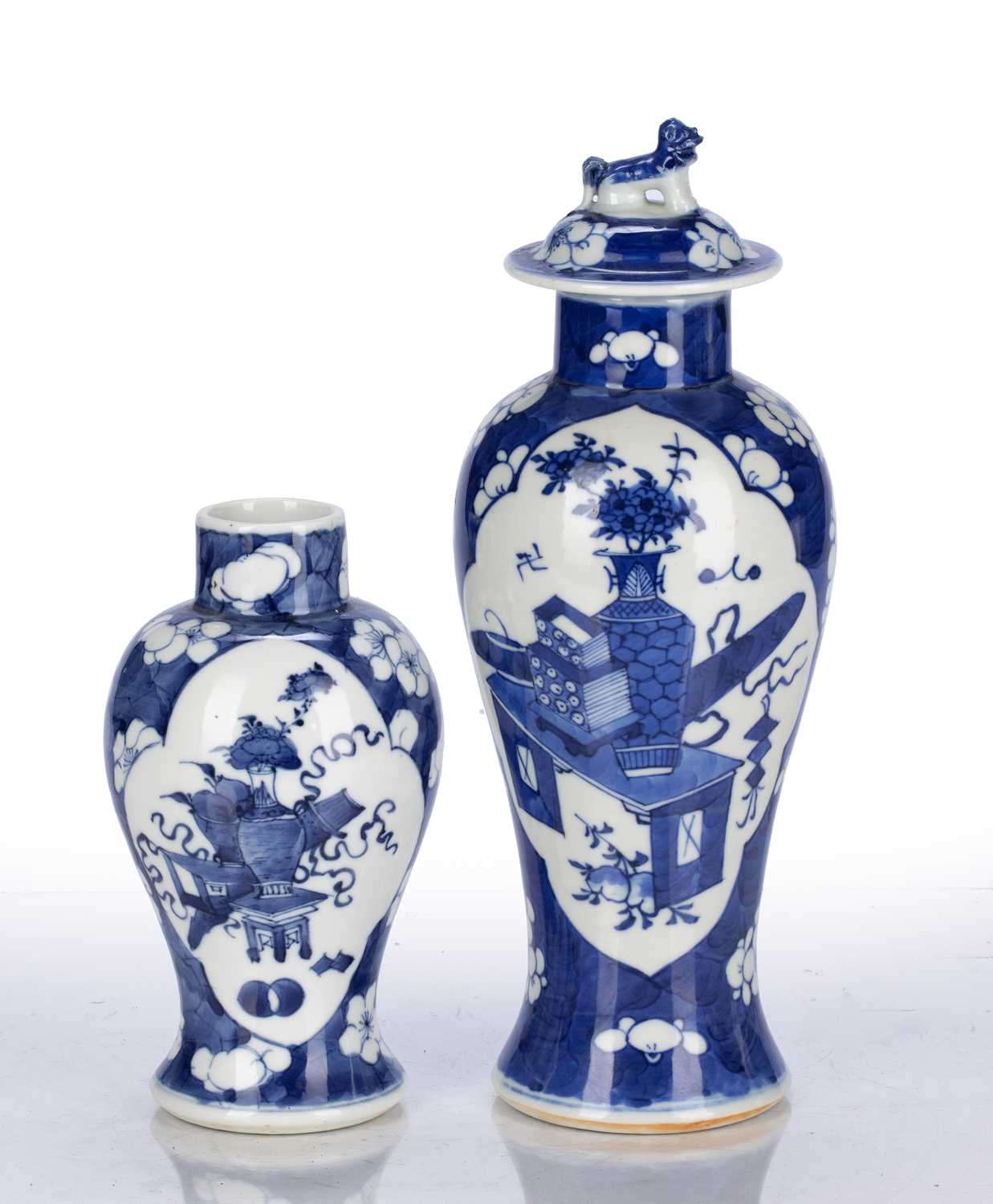 Two blue and white prunus vases Chinese, 19th Century one lidded, both decorated with antiques and - Image 2 of 3