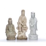 Three Dehua figures of Guanyin Chinese, 19th century comprising of a standing figure, her arms
