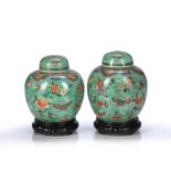 Near pair of green porcelain ginger jars and covers Chinese, circa 1900 painted with butterflies,