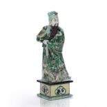 Famille verte guardian figure Chinese, 18th/19th Century the bearded figure standing upon a square