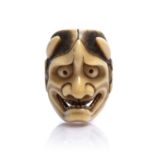 Carved ivory netsuke Japanese, mid 19th Century of demon mask of Hannya, signed possibly