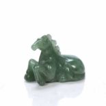 Aventurine quartz model of a horse Chinese facing forward, resting on the ground with its front legs