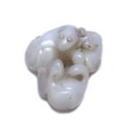 White jade animal group Chinese depicting three dogs socialising, 4.5cm acrossCondition report: