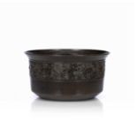 Bronze wastewater pot Japanese, 19th Century for the tea ceremony decorated with a band of waves,