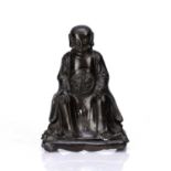 Bronze model of an emperor Chinese, Ming dynasty depicted in a meditation stance with both hands