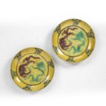 Pair of yellow glazed dragon dishes Chinese, Kangxi mark and period the interior of the bowls