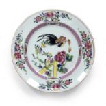 Famille rose plate Chinese, 18th Century painted with a cockerel, fence and peonies, 24cm