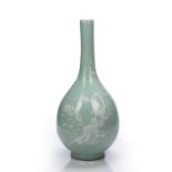 Celadon bottle vase Chinese,18th/19th Century decorated in white slip depicting a flowering tree
