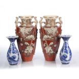 Pair of hexagonal Satsuma vases Japanese, 19th Century each with bold flower decoration on a coral