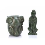 Two spinach jade carvings Chinese comprising of a figure of Guanyin, both of her hands holding