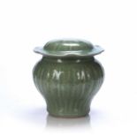 Celadon jar and cover Chinese of ribbed design around the exterior, decorated with flowers, 24cm