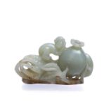 Carved jade group Chinese depicting a boy playing on a citron fruit, 7.5cm acrossCondition report: