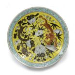 Yellow ground charger Chinese, 19th Century Guangxu painted with two dragons amidst chrysanthemum