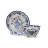 Matching tea bowl and saucer Chinese, 18th Century decorated with flowers in blue and pink