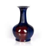 Sang de bouef vase Chinese, 18th/19th Century of bottle vase form with flared neck, 33.5cm