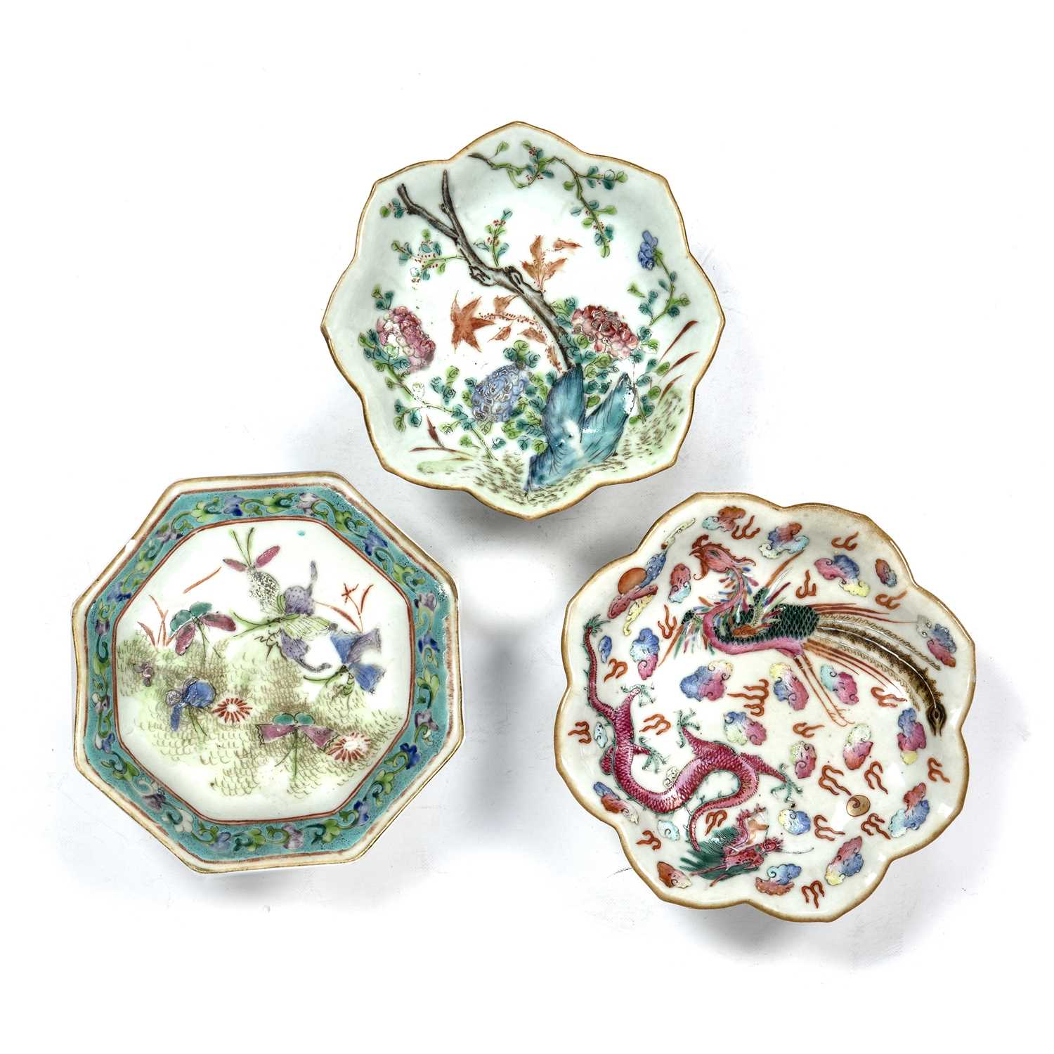 Three famille rose stem dishes Chinese, Tongzhi (1861-1875) one painted with dragons amongst clouds,