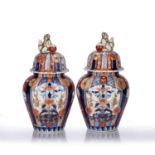 Pair of Imari vases Japanese, 19th Century the ribbed polychrome bodies, having panels of flowers