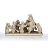 Carved ivory okimono Japanese, Meiji period depicting fisherman and band of children, signed Nagei