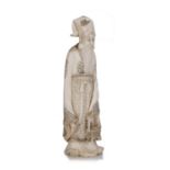 Ivory okimono carved as a standing priest Japanese, late Meiji (1890-1900) with priestly hat and