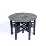 Large brass tray on a folding stand Indian, Benares 76cm diameterCondition report: At present, there