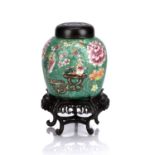 Green ground porcelain ginger jar Chinese, 19th Century painted with a phoenix and flowers, with