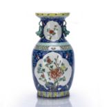 Famille rose baluster vase Chinese painted with two reserve panels of flowering peonies, within a