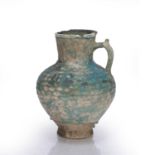 Turquoise glazed pottery jug Kashan, 13th-14th Century of ribbed form, 19.5cm high in an old Chinese