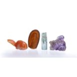 Four miniature hardstone carvings Chinese, 19th Century consisting of a Chinese amethyst weight