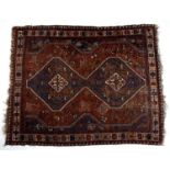 Red ground rug Hamadan with two central medallions and stylised geometric border, 203cm x