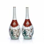 Pair of Arita bottle vases Japanese, 18th Century each painted stalks and blossom, 28.5cm