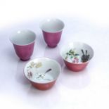 Pair of red glazed cups Chinese with a pink ground to the exterior, the interior decorated with