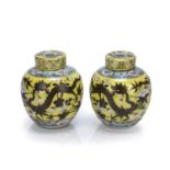 Pair of yellow ground lidded ginger jars Chinese, 19th Century decorated with dragons in flight