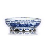 Blue and white porcelain bowl Chinese, painted with a river landscape with bridges, within a ruyi