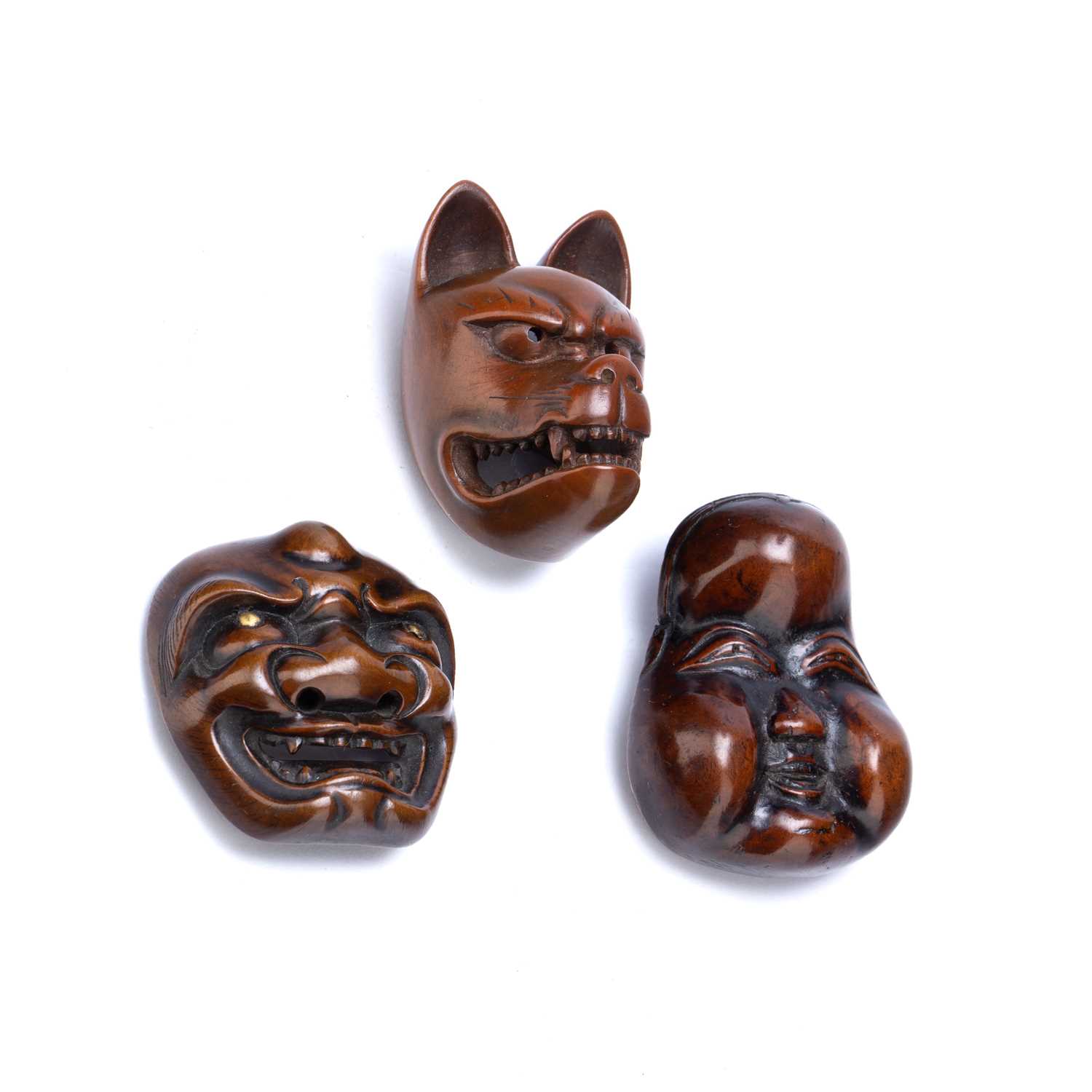 Wood netsuke Japanese, 19th Century of a snarling Kitsune (fox), a wood netsuke of a well