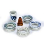 Group of pieces Chinese to include four cup holders, late 19th Century, 10-11cm diameter, a blue and