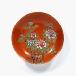 Coral shallow dish Chinese, Republic period painted with flowering peonies, Qianlong mark in red,