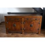 Elm side cupboard Chinese 20th Century the front fitted with drawers and cupboards with brass