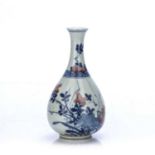 Imari decorated bottle vase Chinese, Kangxi Period decorated with flowers growing from a rocky