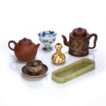 Group of pieces Chinese to include two Yixing teapots, a hardstone pen tray, a stem cup, and two