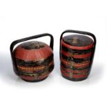 Two lacquer wedding baskets Straits Chinese each of black ground with red woven and giltwood panels,