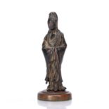 Bronze figure of Guanyin Chinese, 17th/18th Century with her hands met in the middle under her