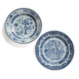 Two blue and white porcelain chargers Chinese, early 19th Century each decorated with 'antiques',